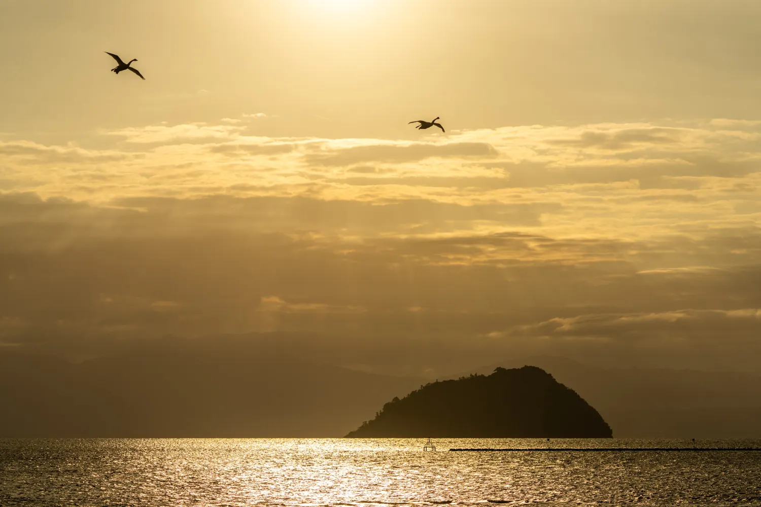 Sunrise over the sea with a small island